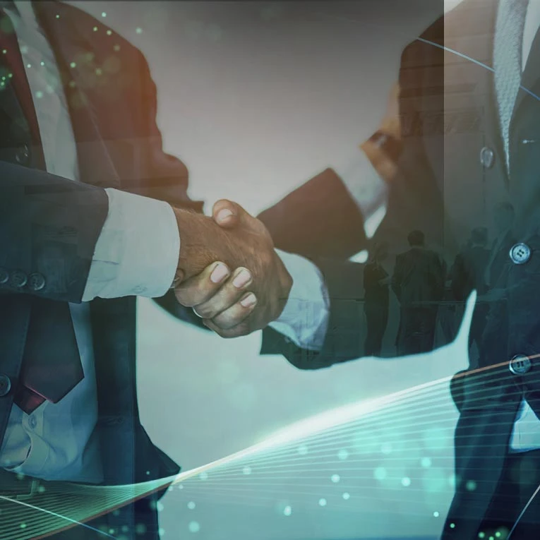Business handshake symbolizing partnership in the live casino gaming industry, representing SA Gaming's partners.